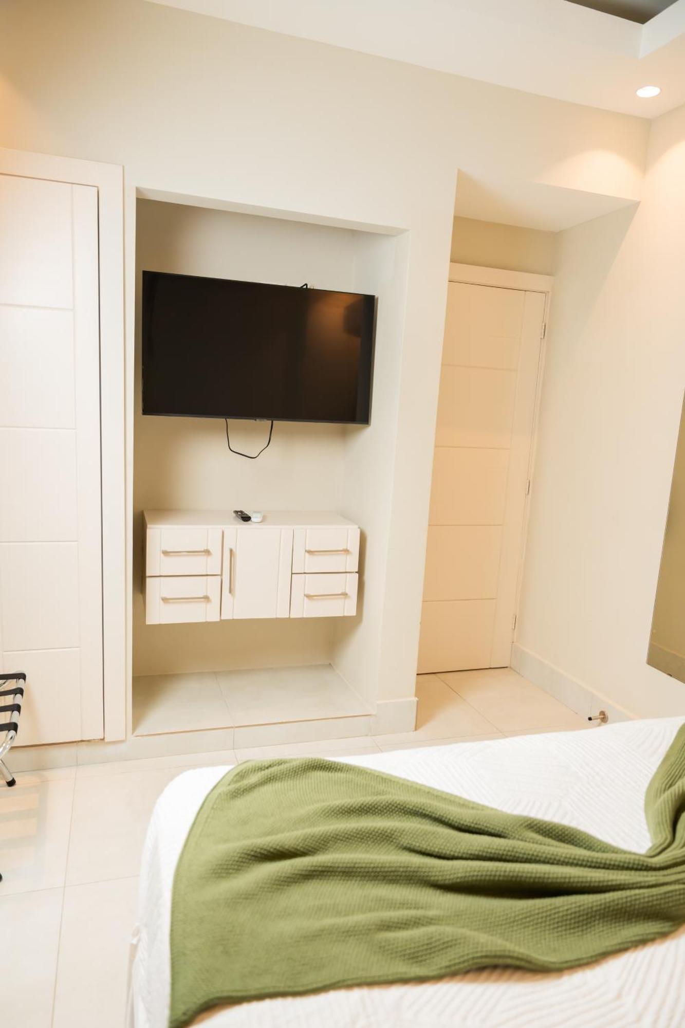 Hotel Stay Here Suites Santo Domingo Phòng bức ảnh